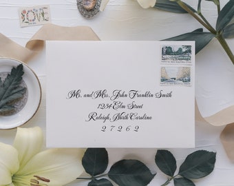 May include: A white envelope with a handwritten address for Mr. and Mrs. John Franklin Smith, 1234 Elm Street, Raleigh, North Carolina 27262. Two postage stamps feature images of trees and the text "Plant More Beautiful Cities".