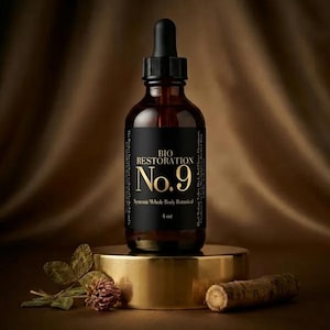 May include: A brown glass bottle with a black label that reads "BIO RESTORATION No. 9" and "Systemic Whole Body Botanical". The bottle has a black dropper and is 4 oz. in size. The bottle sits on a gold stand with a brown background.