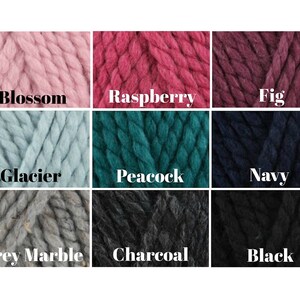 May include: A color chart showing 9 different yarn colors. The colors are: Blossom, Raspberry, Fig, Glacier, Peacock, Navy, Grey Marble, Charcoal, and Black.