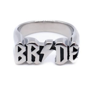 May include: A silver ring with the word "BRIDE" in black lettering.