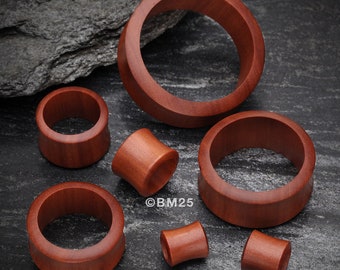 A Pair of Sabo Wood Double Flared Tunnel Plug