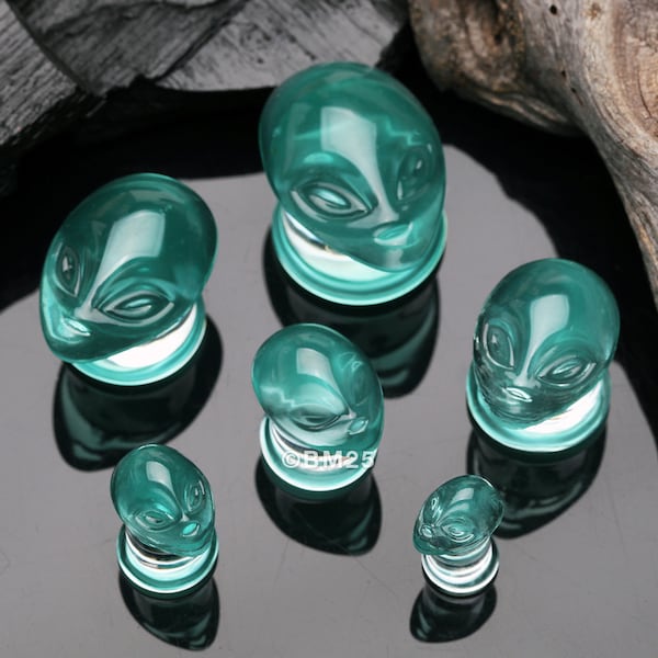 A Pair Of Green Alien Head Glass Double Flare Plugs