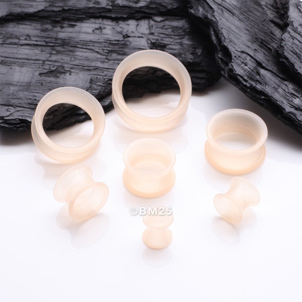 A Pair of Peach Tone Flexible Silicone Double Flared Tunnel Plug