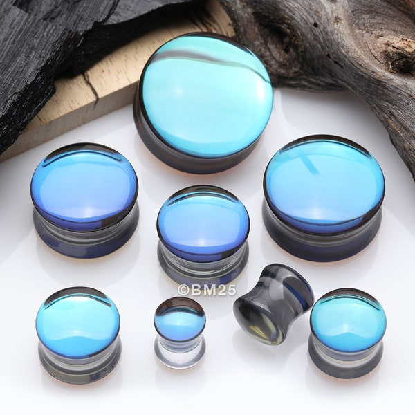 A Pair Of Midnight Moon Iridescent Glass Double Flared Ear Gauge Plug