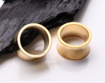 A Pair of Golden Solid Steel Double Flared Ear Gauge Tunnel Plug