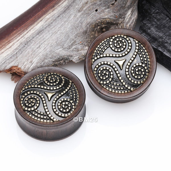 A Pair Of Antique Triskelion Spiral Decorated Ebony Wood Double Flared Plug