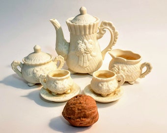 Miniature Footed Tea Set Dollhouse Creamy Bisque Porcelain Embossed Floral Design 10 Pieces Teapot Creamer Sugar Cups And Saucers 1970s