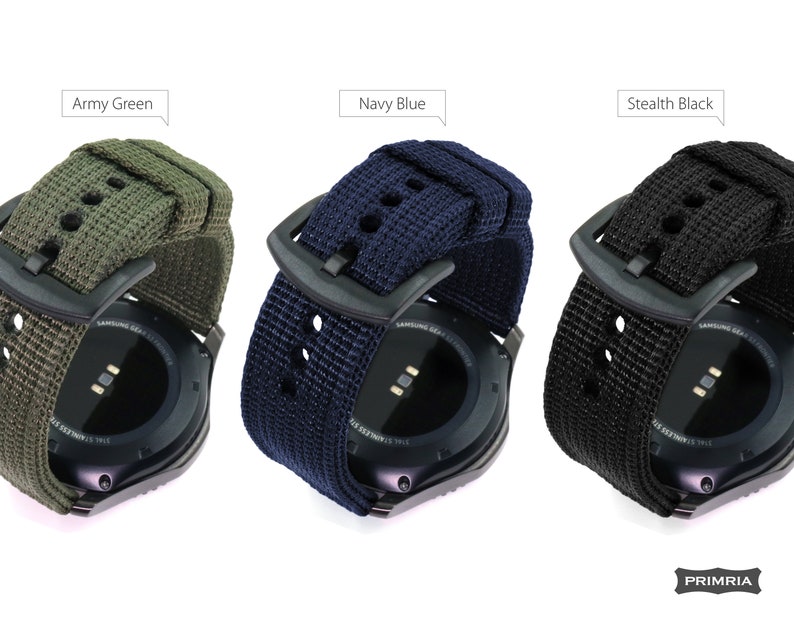 May include: Three different colored nylon watch bands for a Samsung Gear smartwatch. The bands are army green, navy blue, and stealth black.