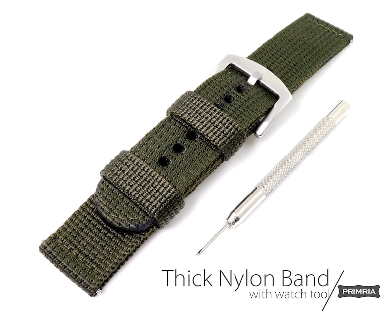 May include: A green nylon watch band with a silver buckle and a watch tool. Thick Nylon Band / with watch tool PRIMRIA