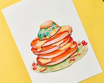 May include: A watercolour illustration of a stack of pancakes with a small green and yellow frog sitting on top. The pancakes are covered in a yellow sauce and there are red berries scattered around the plate.