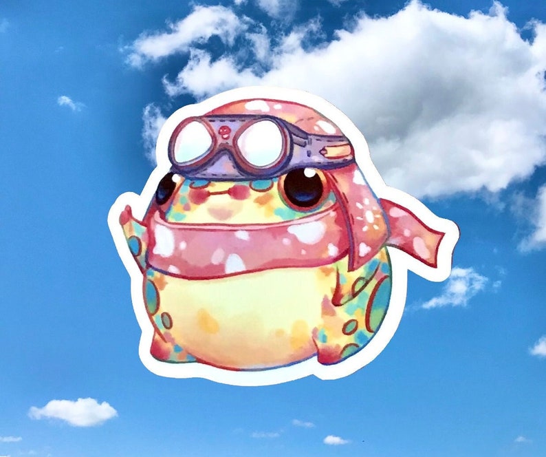 May include: A colourful cartoon frog wearing a pink and white scarf and goggles. The frog is looking up at the sky.
