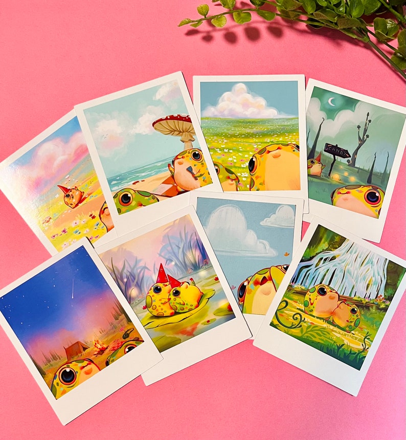 May include: Set of eight illustrated postcards featuring cartoon frogs in various settings. The postcards are printed on white cardstock with a white border. The frogs are depicted in a variety of poses and expressions, including smiling, sleeping, and playing. The postcards are perfect for sending a whimsical message to a friend or loved one.
