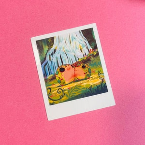 May include: A whimsical illustration of two green and pink frogs kissing in front of a waterfall in a lush green forest.