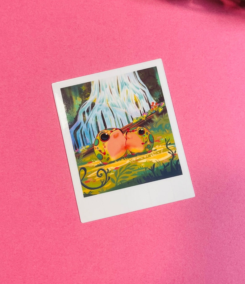 May include: A whimsical illustration of two green and pink frogs kissing in front of a waterfall in a lush green forest.