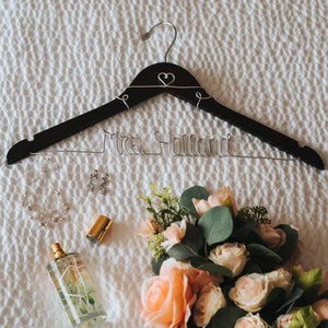 Custom Bridal Hanger- Celebrate your special day with our custom wedding dress hangers. These hangers feature your name or date in beautiful wire, perfect for showcasing your dress and making an excellent bridal gift for lasting memories.