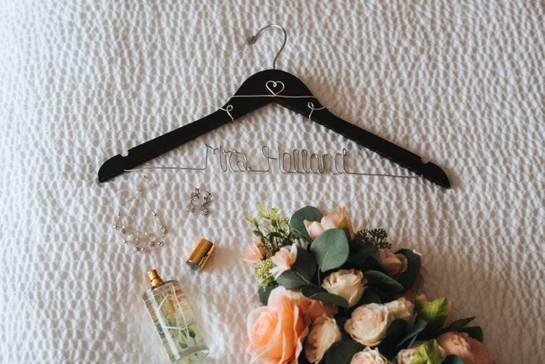 Custom Bridal Hanger- Celebrate your special day with our custom wedding dress hangers. These hangers feature your name or date in beautiful wire, perfect for showcasing your dress and making an excellent bridal gift for lasting memories.