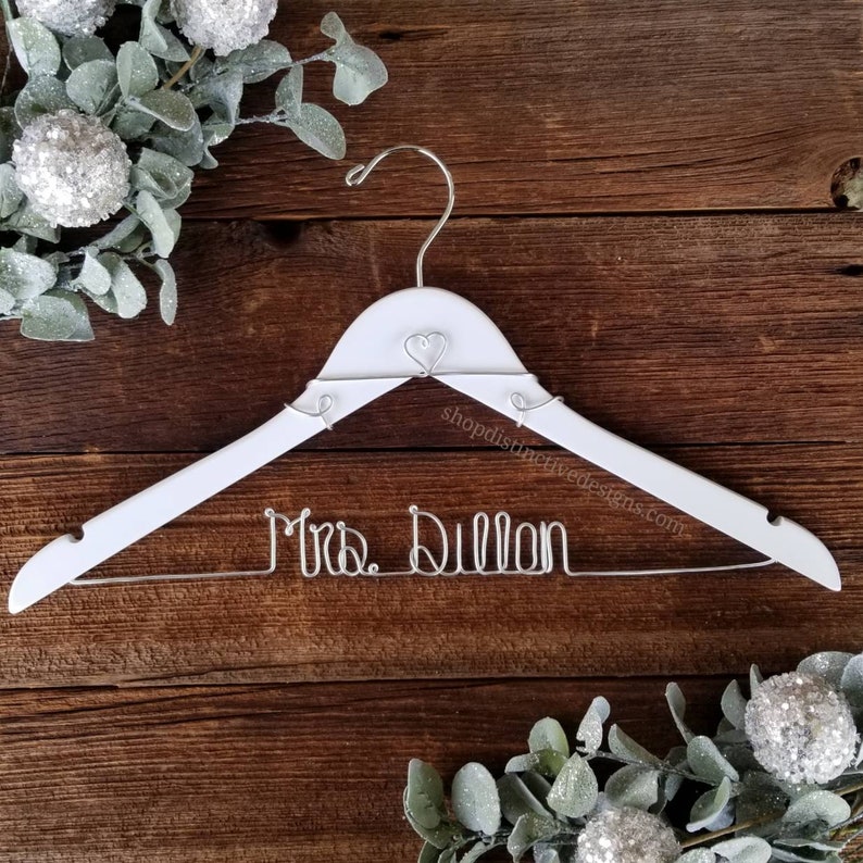 Personalized Bridal Hanger - Enhance your wedding day with our custom hangers. Featuring your name or date in exquisite wire, these hangers are perfect for displaying your dress and make a fantastic bridal gift for memorable photos.