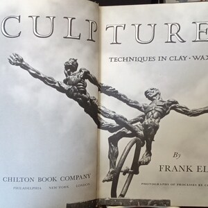 May include: A black and white photo of a book titled "Sculpture: Techniques in Clay, Wax, Slate" by Frank Eliscu. The cover features a sculpture of two figures in a dynamic pose.