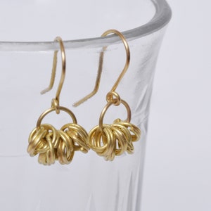 Yellow gold hoop earrings image 1