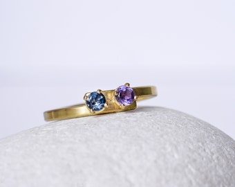 Amethyst and blue topaz yellow gold ring