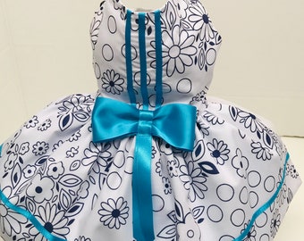 White and navy flowery dress with turquoise ribbon detail