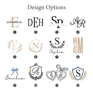 May include: Image showcasing twelve design options for personalized items. The designs include various fonts, monograms, and decorative elements such as floral wreaths, bows, and hearts. The text "Design Options" is at the top.