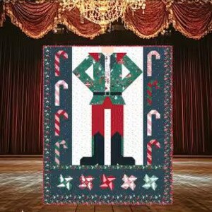 以下が含まれることがあります： 「Be a Nutcracker」というタイトルのキルトパターン。赤、緑、白のくるみ割り人形の図案。キルトにはキャンディケーンと星の模様があります。完成サイズは152cm x 183cmです。