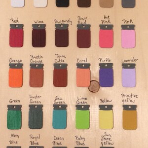 May include: A wooden color chart featuring various paint colors in mason jar shapes. Colors include white, black, red, orange, green, and blue, with labels like "Burgundy," "Coral," and "Sun Shine Yellow." The text "Starr Events" is at the top and bottom.