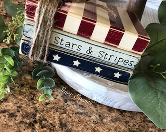 Patriotic tier tray 4th of July decor. Fourth of July faux books. Red white and blue decor. Rustic Americana decor Stars and stripes