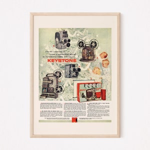 May include: A vintage advertisement for Keystone automatic home movies. The ad features five different models of Keystone movie cameras and projectors, including the Keystone K-80, K-100, and K-120. The ad also features a slogan: "You're looking at today's smartest buys in automatic home movies...KEYSTONE."