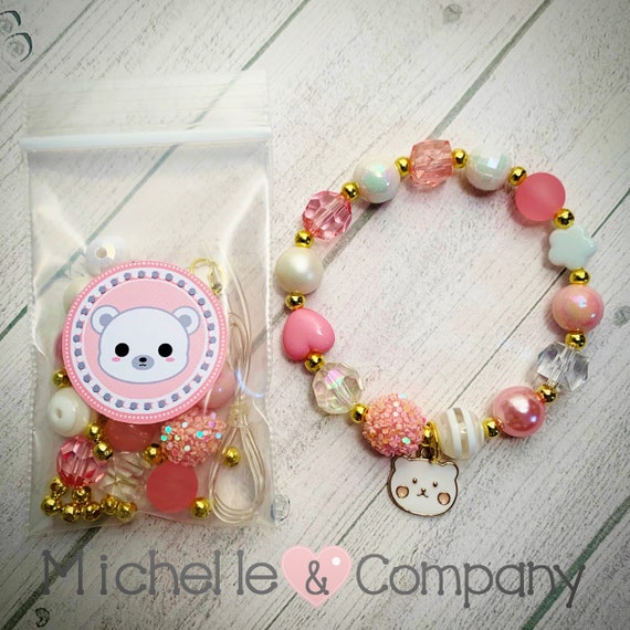 Bracelet charm's cadeau de Noël, ours en peluche et poupée