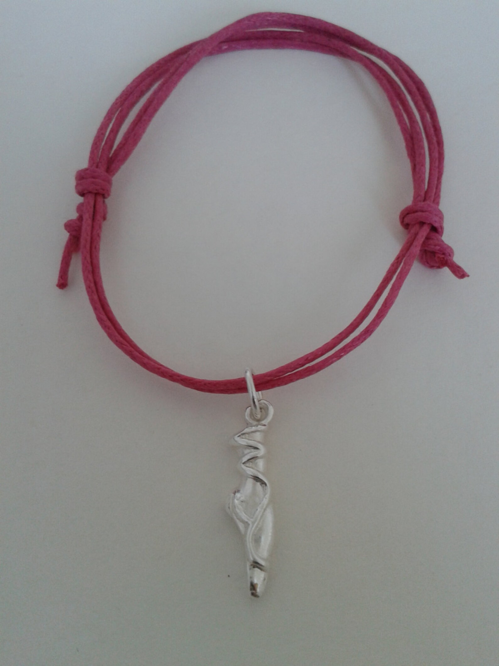dainty point ballet shoe silver charm, cotton braid adjustable silver charm bracelet, solid silver charm on coloured cord, uk se