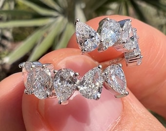 3,00 karat päronformad diamantring med vridna öppningsbara cocktailringar, omlottring med stift, jubileumsring i 14 karat vitt gult roséguld