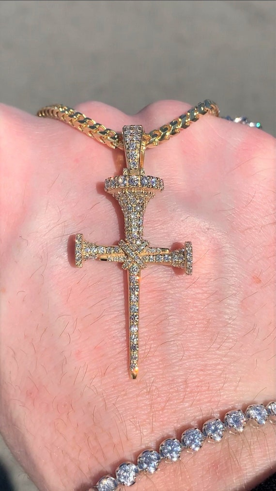 Diamond nail on sale cross pendant