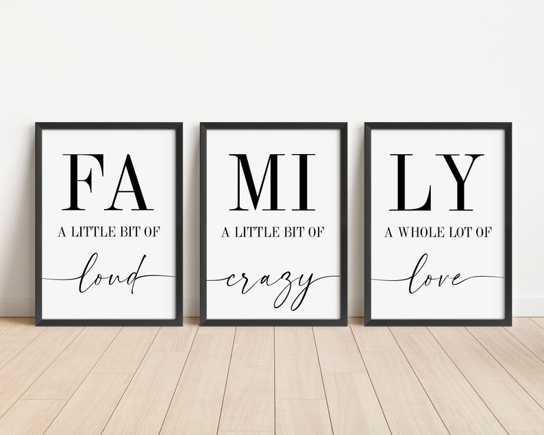 May include: Three black framed prints with white backgrounds. The prints read "FA A LITTLE BIT OF loud", "MI A LITTLE BIT OF crazy", and "LY A WHOLE LOT OF love".