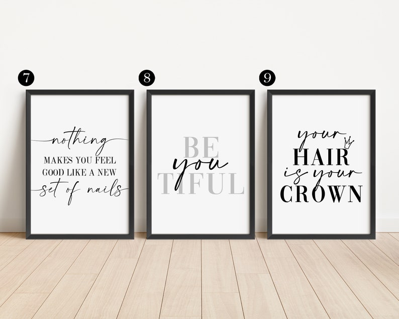 May include: Three black framed prints with white backgrounds and black text. The first print says "nothing makes you feel good like a new set of nails". The second print says "Be you tiful". The third print says "your hair is your crown" with a crown symbol.