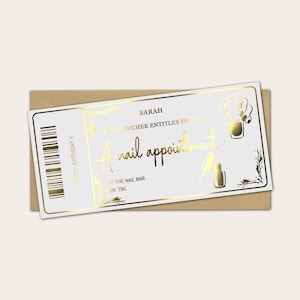 May include: A white gift certificate for a nail appointment with gold foil accents. The certificate reads "Sarah" and "A nail appointment" in elegant script. The certificate is on a brown envelope.