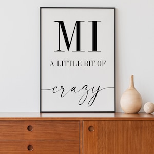 May include: Black and white printable wall art with the text "MI A LITTLE BIT OF crazy".