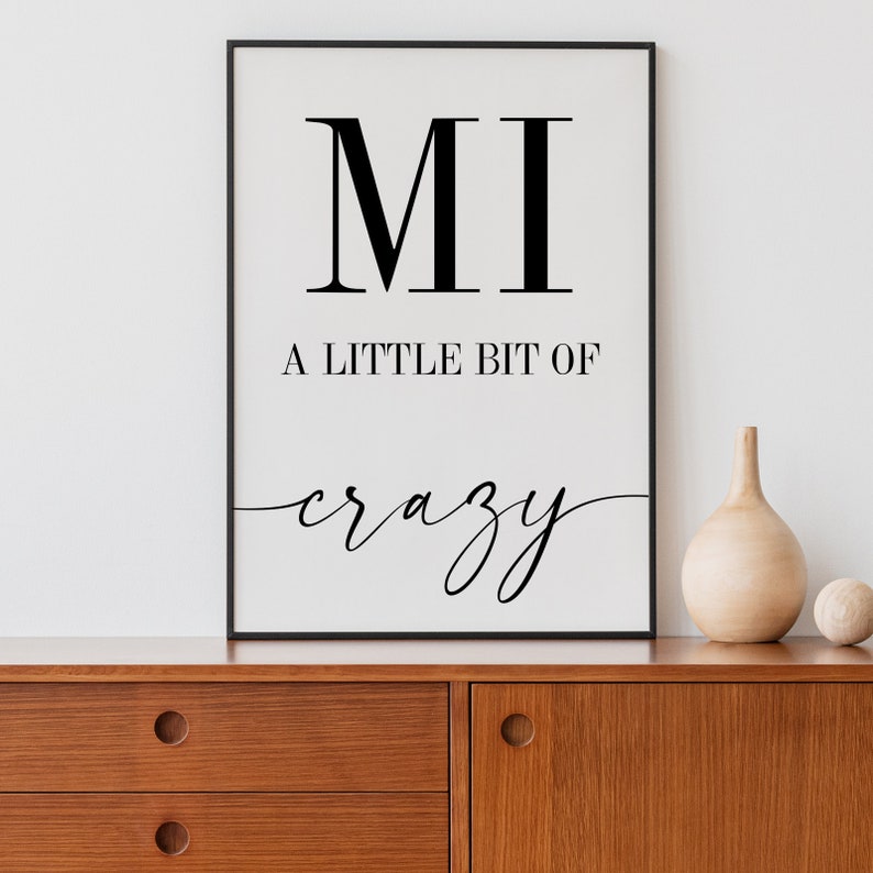 May include: Black and white printable wall art with the text "MI A LITTLE BIT OF crazy".