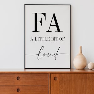 May include: Black and white printable wall art with the text "FA A little bit of loud" in a modern minimalist style.