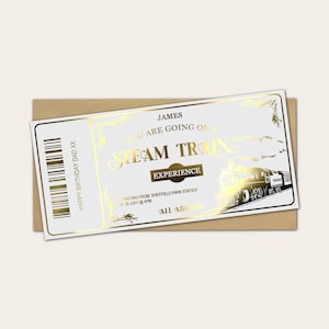 May include: A white ticket with gold foil detailing, featuring the words "STEAM TRAIN EXPERIENCE" and a train illustration. The ticket is on a brown envelope and includes the text "HAPPY BIRTHDAY DAD XX".