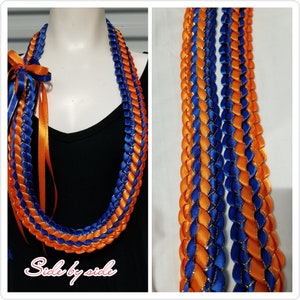 Collier double ruban orange et bleu avec bordure dorée