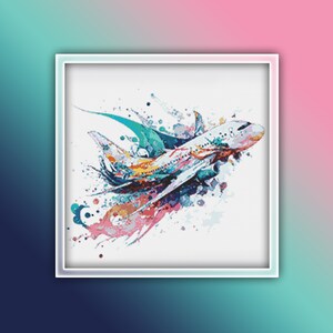 May include: A white airplane with colorful watercolor splashes around it. The airplane is flying through the air, and the splashes are creating a sense of motion.