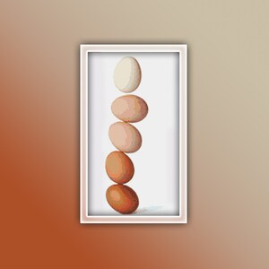 May include: A stack of five eggs, with the top egg being white and the rest being shades of brown, arranged in a vertical line.