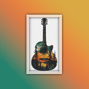 May include: A black acoustic guitar with a colorful nature scene design. The guitar has a sunset, trees, and mountains on the body.