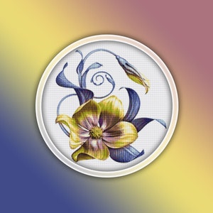 Puede incluir: Una flor amarilla y morada con hojas y tallos azules en un aro de bordado blanco. La flor está en el centro del aro y las hojas y los tallos están alrededor.