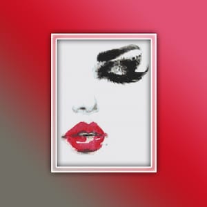 May include: A close-up of a woman's face with bold black eyeliner and red lipstick. The background is white.