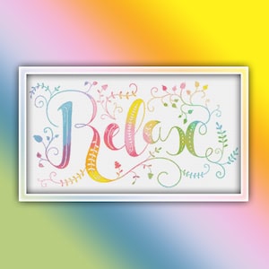May include: A framed cross-stitch design with the word "Relax" in colorful, cursive lettering. The letters transition through shades of blue, pink, yellow, and green, surrounded by floral and vine accents. The frame is white.