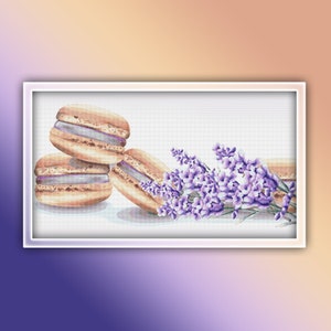 May include: A watercolour illustration shows three macarons with lavender-coloured filling, arranged together. A sprig of purple lavender flowers is placed beside the macarons, creating a visually appealing composition.