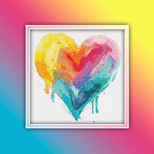 May include: A colorful heart-shaped design with dripping paint in shades of yellow, orange, red, purple, blue, and green.